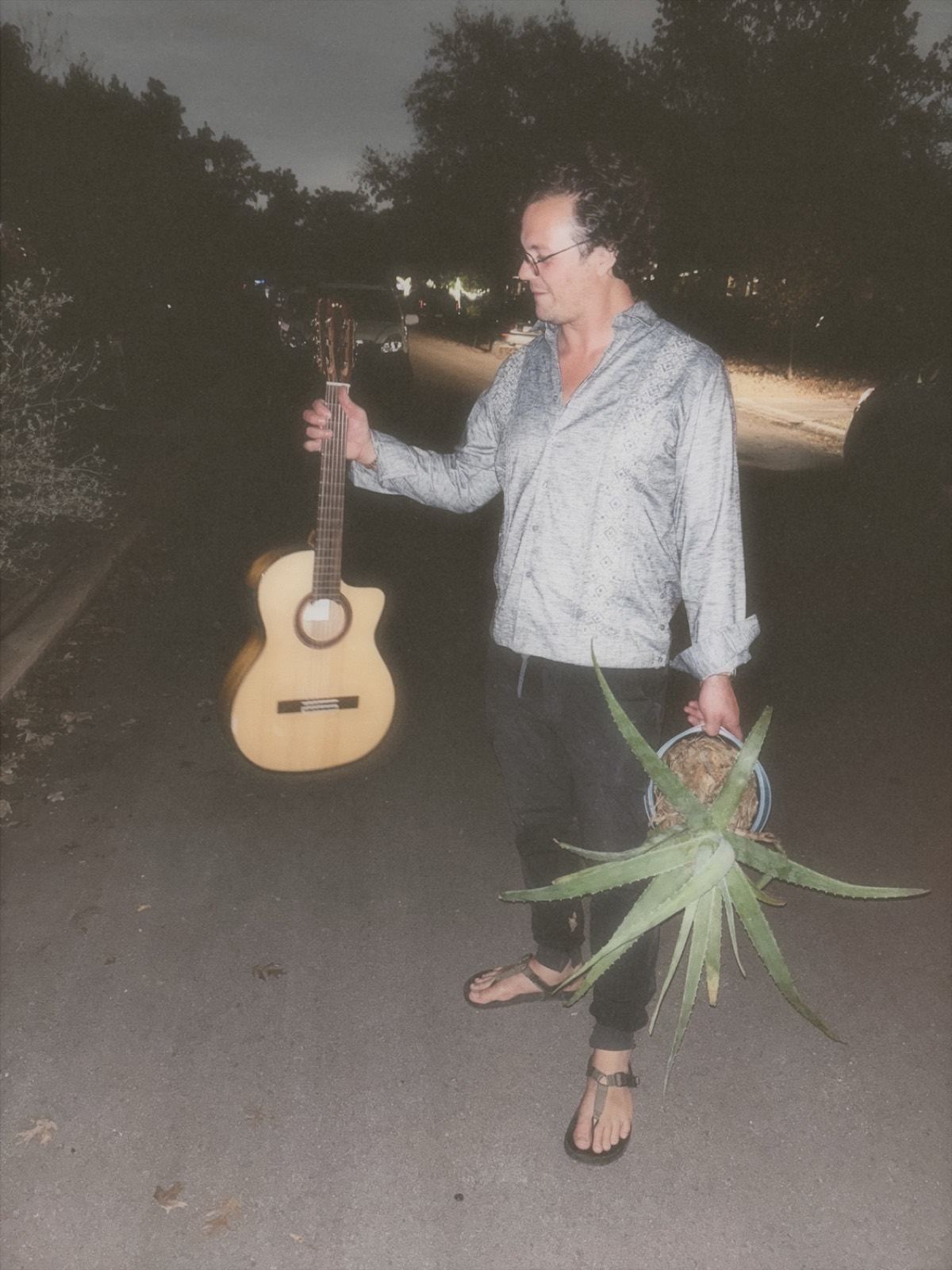 Dorian Dégagé, who records as DÉGAGÉ — with guitar, San Antonio, Texas